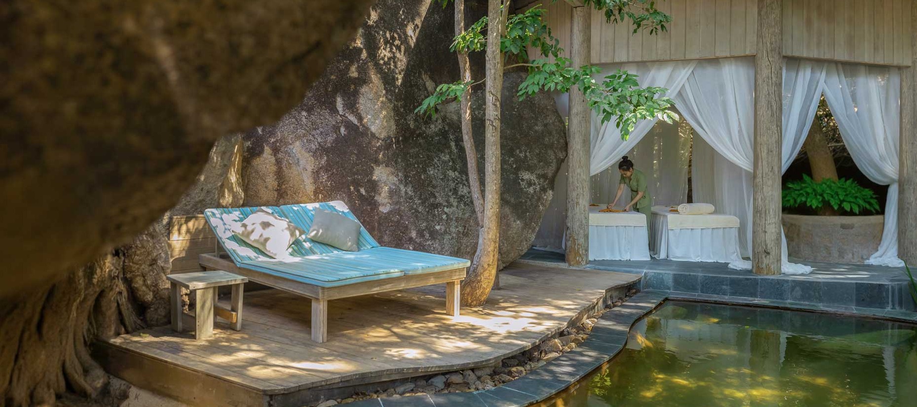 A serene, luxurious spa setting at An Lam Retreats, where wellness treatments are enjoyed in nature-immersed pavilions