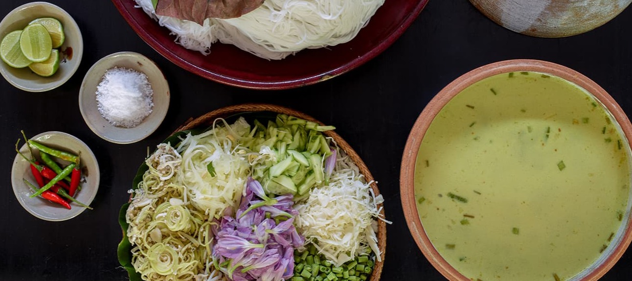 "Fresh Vietnamese pho ingredients with herbs, noodles, and aromatic broth